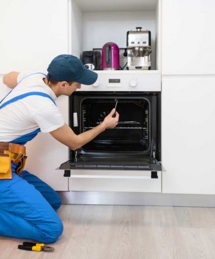 man repairing oven - About Athens Appliance Repair Pros - Oven Repair Athens